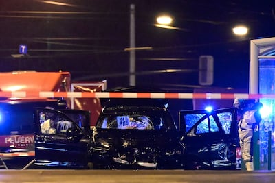 Forensics officers inspect the car involved in the ramming attack in Magdeburg. AFP