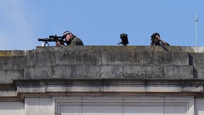 Police marksmen on the roof of Buckingham Palace. PA