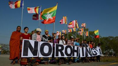 An anti-Rohingya hardline Buddhist group, together with Buddhist monks, rally outside Yangon’s Thilawa port as a Malaysian ship carrying relief aid for Rohingya Muslim minority arrives on February 9, 2017. Romeo Gacad / AFP