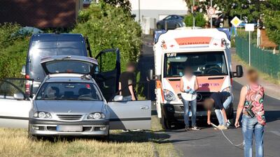 Policemen securing evidences close to an ambulance car and a passenger car in Biebergemuend near Bad Orb, western Germany, where a German man, the suspected aggressor, was found dead in a car, following a drive-by shooting in the nearby village of Waechtersbach. AFP