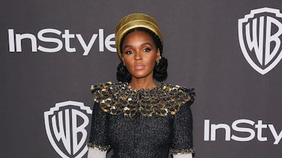 US singer-songwriter Janelle Monae arrives for the Warner Bros. and In Style 20th annual post Golden Globes party looking exquisite in a black and gold fantasy tweed, Chanel dress with a gold leather hat. AFP