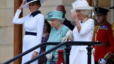 Britain's Queen Elizabeth II (C) stands with US First Lady Melania Trump (L) and Britain's Camilla, Duchess of Cornwall (R) during a welcome ceremony at Buckingham Palace in central London on June 3, 2019, on the first day of the US president and First Lady's three-day State Visit to the UK. Britain rolled out the red carpet for US President Donald Trump on June 3 as he arrived in Britain for a state visit already overshadowed by his outspoken remarks on Brexit. / AFP / POOL / TOBY MELVILLE
