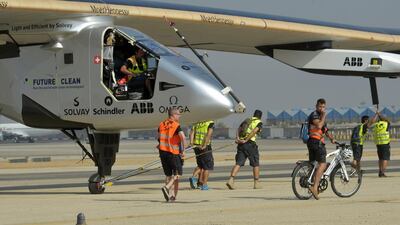 Solar Impulse 2 ground crew surround the aircraft after it landed at Cairo International Airport. Khaled Desouki / AFP