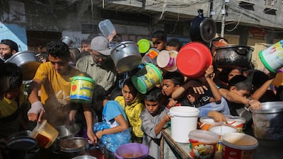 Palestinians crowd together as they wait for food distribution in Rafah, southern Gaza Strip, November 8, 2023. AP