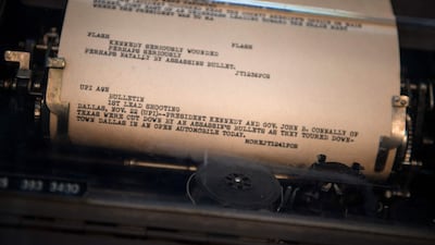 A newswire is displayed in a teletype reporting the 1963 assassination of John F Kennedy, the US president at the time. AFP