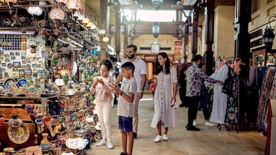 A family shops in one of Dubai's traditional souks. Courtesy Dubai Tourism