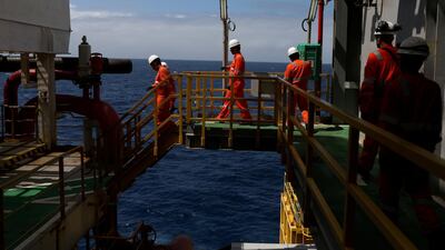 Workers in safety gear on an oil rig owned by Petrobras in the offshore Santos basin in Rio de Janeiro. Increasing automation and digtalisation could reduce the amount of workers on rigs. Reuters
