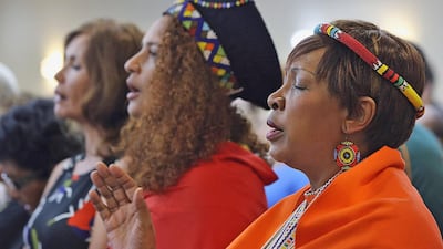 Pumla Mbana, right, was among those attending a public memorial for Nelson Mandela, held at the Evangelical Community Church in remembrance and honour of South Africa's former president. Delores Johnson / The National
