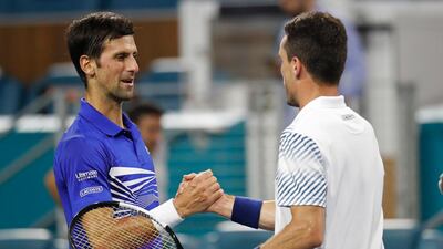 Novak Djokovic, left, and Roberto Bautista Agut greet each other at the net after their Miami Open fourth round clash. Reuters