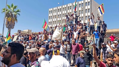 Syrians protesting against the regime of President Bashar Al Assad in the southern Syrian city of Suweida. AFP