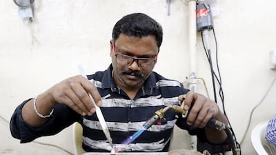 Surenderan K, a Keralite, working in a silver shop in Sharjah. A study is under way investigating the movement of Keralites to the Middle East for jobs has begun. Pawan Singh / The National