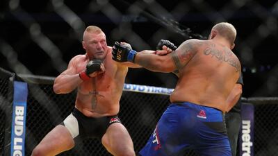 Brock Lesnar punches Mark Hunt, right, during the UFC 200 event at T-Mobile Arena on July 9, 2016 in Las Vegas, Nevada. Rey Del Rio / Getty Images