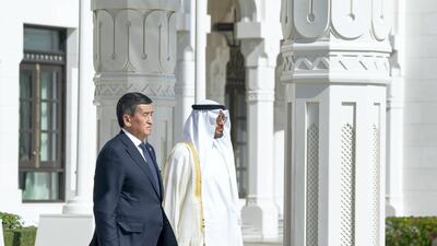 Sheikh Mohamed bin Zayed and Sooronbay Sharipovich Jeenbekov stand outside Qasr Al Watan. Hamad Al Mansoori for the Ministry of Presidential Affairs