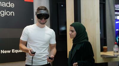 Elaf Alsalman walking a user through a virtual reality experience. Photo: PwC Middle East