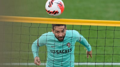 Portugal's Joao Moutinho heads a ball during a training session in Oeiras. AP