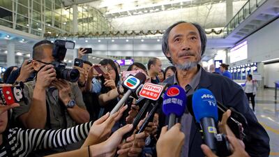 In this November 9, 2018, photo, Chinese dissident writer Ma Jian speaks to media after arriving Hong Kong international airport. AP