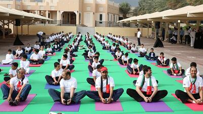 The Office of The Crown Prince of Dubai (CPD) marks UAE National Sports Day as 50 employees and 100 children do yoga in front of the CPD main building. Courtesy The Office of The Crown Prince of Dubai (CPD)