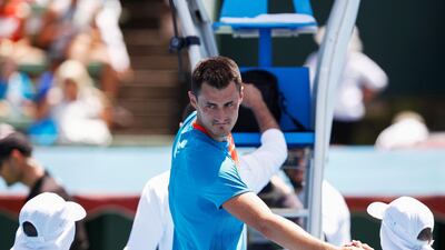 Bernard Tomic of Australia greets ballboys after his match against Nick Kyrgios at the Kooyong Classic in Melbourne. EPA