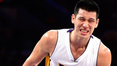 Jeremy Lin grimaces during the Lakers' loss to the Houston Rockets on Sunday night. Hary How / Getty Images / AFP / January 25, 2015
