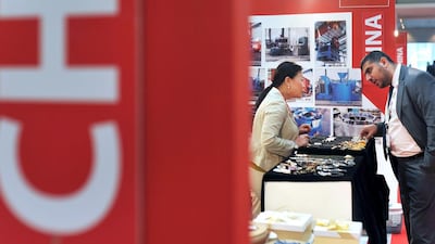 A visitor browses for jewellery at a booth during the China Trade Week exhibition at ADNEC in Abu Dhabi. Delores Johnson / The National