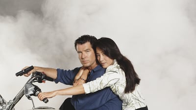 Pierce Brosnan as James Bond alongside Yeoh in Tomorrow Never Dies, 1997. Getty Images