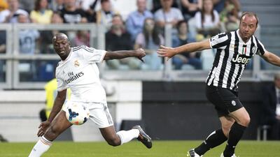 Real Madrid Legends midfielder Claude Makelele, left, vies with Juventus Legends defender Alessandro Birindelli during the Unesco Cup football match on Monday. Marco Bertorello / AFP / June 2, 2014
