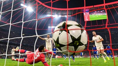 Harry Kane (right) of Bayern Munich scores past Dinamo Zagreb's goalkeeper Ivan Nevistic during the UEFA Champions League match in Munich, Germany. EPA