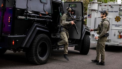 Tactical teams take up position. AFP