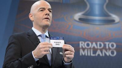 Gianni Infantino shows Arsenal during the Champions League last 16 draw on Monday in Nyon, Switzerland. Laurent Gillieron / EPA / December 14, 2015