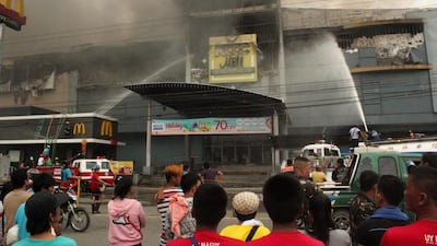 A view of a burning shopping mall in Davao city, southern Philippines, on December 23, 2017. The photo was issued on December 24. Ruby Embrano / EPA
