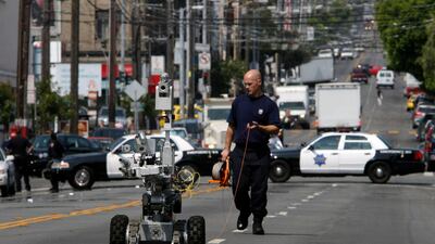A police officer uses a robot to investigate a bomb threat in San Francisco in 2008. The liberal city of San Francisco became the unlikely proponent of weaponised police robots in November before the plan was sent back to the drawing board. AP