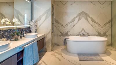 There's no shortage of marble in the bathrooms. Courtesy LuxuryProperty.com