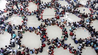 Indonesian students sit in circles as they read the Quran on the first day of Ramadan at Ar-Raudhatul Hasanah Islamic boarding school in Medan, North Sumatra, Indonesia. EPA