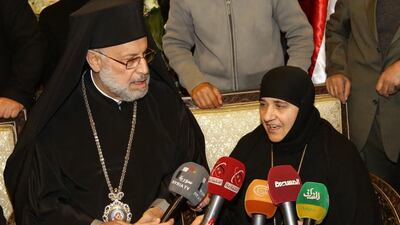 One of the Syrian Greek Orthodox nuns, kidnapped north of Damascus on December 6, is interviewed following their release by Syrian rebels on Monday, March 10, 2014. Youssef Badawi / EPA