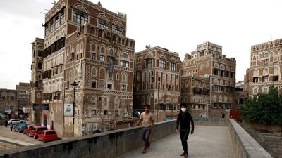 A Yemeni walks past historic buildings in the old quarter of Sanaa, Yemen. EPA