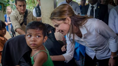 Queen Rania of Jordan talks to Rohingya Muslim women, who have crossed over from Myanmar into Bangladesh, during her visit to Kutupalong refugee camp, Bangladesh. Dar Yasin / AP Photo
