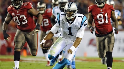 Cam Newton threw for 221 yards and registered a 111.6 passer rating on Thursday night. Brian Blanco / AP