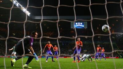 Moussa Dembele of Celtic scores his team’s third goal against Manchester City in Glasgow. Michael Steele / Getty Images