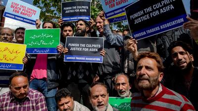 Kashmiri traders and local residents shout slogan during a protest against the rape and murder of 8-year-old Asifa, in Srinagar, Indian-controlled Kashmir, on April 13, 2018. Dar Yasin / AP Photo