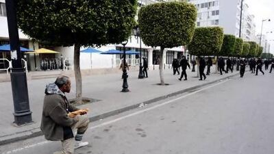 The 2011 Tunisian protests were in part symbolised by the appearance of Captain Khobza a middle-aged man who turned to confront the approaching ranks of riot police holding a baguette as if it were a machine-gun. Fred Dufour / AFP Photo