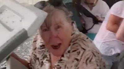 People protect themselves from a hailstorm during a birthday party in Warrandyte, Victoria, Australia. Reuters