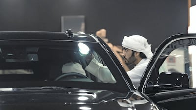 A visitor looks over one of Inka's customised GMCs. Olga Voronova / Inkas