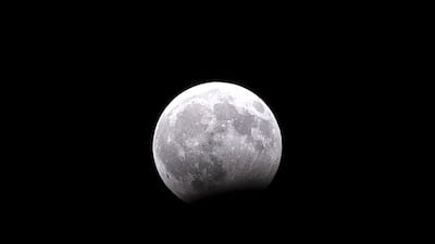 The moon during a partial lunar eclipse. Photo by Reem Mohammed / The National.