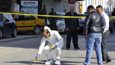 Tunisian forensic police check the scene of a knife attack on two traffic policemen near the parliament building in Tunis, Tunisia, on November 1, 2017. EPA