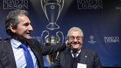 Manchester City director Txiki Begiristain, left, shakes hands with former Barcelona vice-president Amador Bernabeu after the Champions League last-16 draw on Monday in Nyon, Switzerland. Laurent Gillieron / EPA