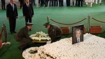 The Russian foreign minister Sergei Lavrov, left, stands next to the Lebanese majority leader, Saad Hariri, at Rafik Hariri's grave.