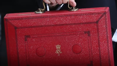 Philip Hammond holds the red case as he departs 11 Downing Street in 2017