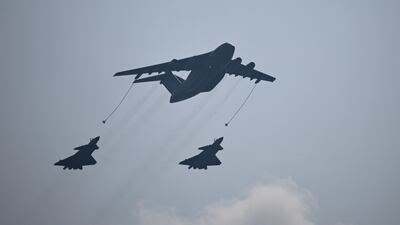 Two Mighty Dragon J-20 stealth fighters and a tanker plane of the People's Liberation Army Air Force fly over the military parade in Beijing marking the 80th anniversary of the end of the Sino-Japanese War. EPA