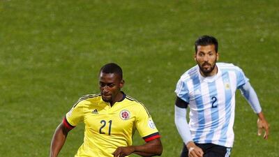 Colombian striker Jackson Martinez, left, fights with Argentinian defender Ezequiel Garay during the Copa America 2015 quarter-final match at Estadio Sausalito in Vina del Mar, Chile, 26 June 2015. EPA/Javier Valdes