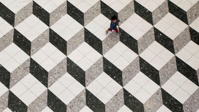 A boy walks at a shopping mall in Tokyo, Japan. Toru Hanai / Reuters